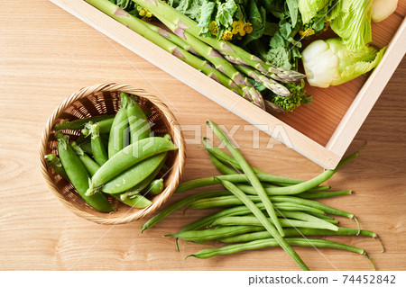 Green vegetables in a wooden box Green vegetables in a wooden box 74452842