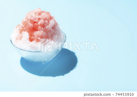 Fluffy shaved ice light blue background 74453910