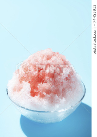 Fluffy shaved ice light blue background Fluffy shaved ice light blue background 74453912