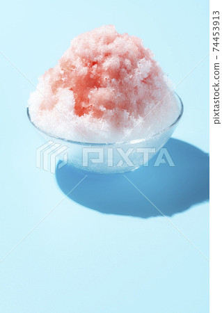Fluffy shaved ice light blue background Fluffy shaved ice light blue background 74453913