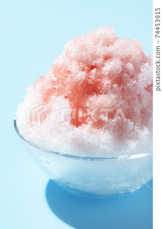 Fluffy shaved ice light blue background Fluffy shaved ice light blue background 74453915