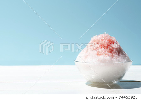 Fluffy shaved ice light blue background Fluffy shaved ice light blue background 74453923