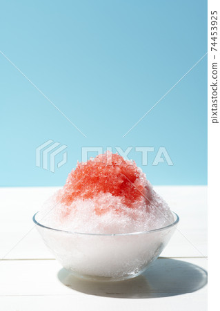 Fluffy shaved ice light blue background 74453925