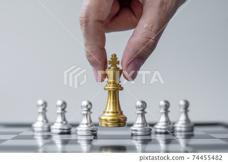 gold Chess King figure Stand out from the crowd on Chessboard background. Strategy, leadership, business, teamwork, different, Unique and Human resource management concept gold Chess King figure Stand out from the crowd on Chessboard background. Strategy, leadership, business, teamwork, different, Unique and Human resource management concept 74455482