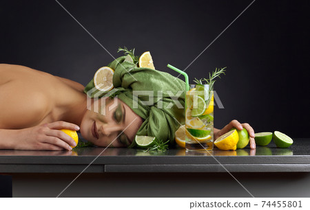 young woman with a drink of lemon and lime young woman with a drink of lemon and lime 74455801