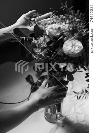 Female hand with a bouquet of roses [monochrome] 74455885