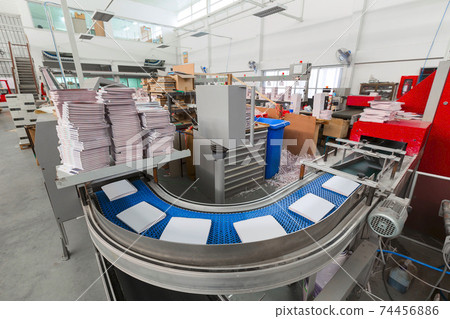 The conveyor with magazines. Printing factory. A stream of journal production. 74456886