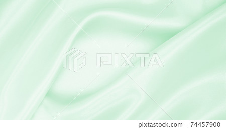 Smooth elegant green silk or satin luxury cloth texture as abstract background. Luxurious background design Smooth elegant green silk or satin luxury cloth texture as abstract background. Luxurious background design 74457900