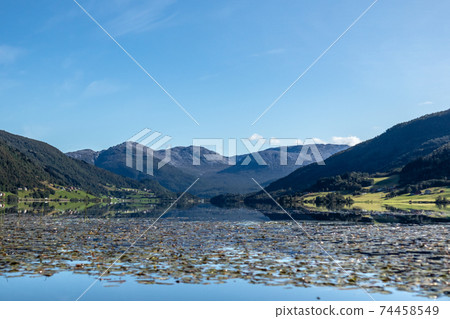 Norway mountain lake mirror on sunny day landscape Norway mountain lake mirror on sunny day landscape 74458549