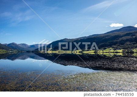 Norway mountain lake mirror on sunny day landscape 74458550