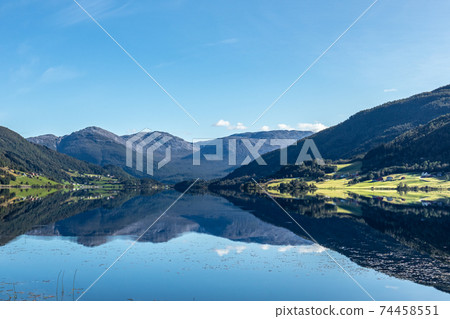 Norway mountain lake mirror on sunny day landscape Norway mountain lake mirror on sunny day landscape 74458551