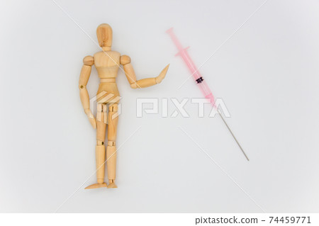 Image of refusing new coronavirus vaccination: Syringe and person Image of refusing new coronavirus vaccination: Syringe and person 74459771