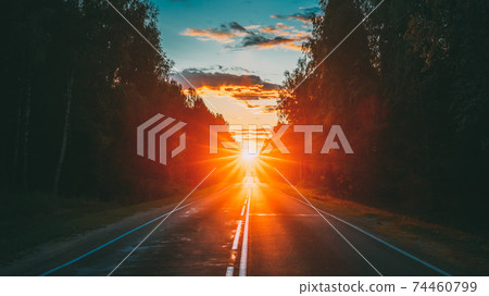 Sun Shine Above Asphalt Country Open Road In Sunny Morning Or Evening. Open Free Road In Summer Or Autumn Season At Sunny Sunset Or Sunrise Time Sun Shine Above Asphalt Country Open Road In Sunny Morning Or Evening. Open Free Road In Summer Or Autumn Season At Sunny Sunset Or Sunrise Time 74460799