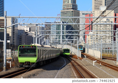 Yamanote Line E235 series and Keihin Tohoku Line E233 series at Takanawa Gateway Station 74461925