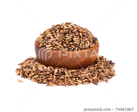 Milk Thistle seed in wooden bowl, isolated on white background. Silybum marianum, Scotch Thistle or Marian Thistle. 74461967