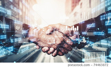 Imaginative visual business handshake with computer graphic of investment data 74463872