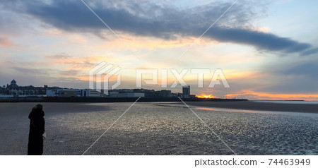 View of a beach in Liverpool at sunset, United Kingdom View of a beach in Liverpool at sunset, United Kingdom 74463949