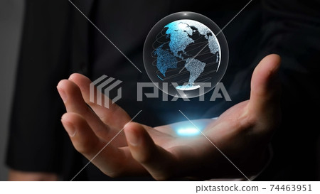 Human hand holding earth globe holographic technology Human hand holding earth globe holographic technology 74463951