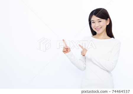 Female in her 30s White background pointing 74464537