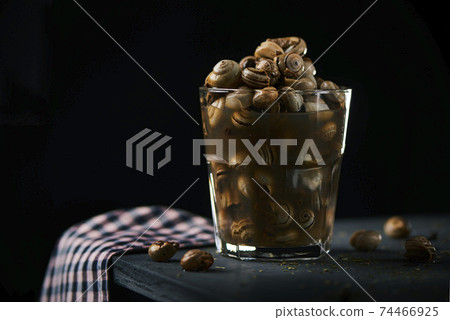 spanish recipe of snails in brow, in a glass on the spanish recipe of snails in brow, in a glass on the 74466925