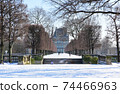 Paris, France - February 11th 2021: Paris under the snow at the Tuileries garden. 74466963