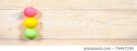 red, yellow and green easter eggs over rustic wooden planks red, yellow and green easter eggs over rustic wooden planks 74467284