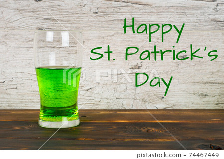 Happy St.Patrick's Day, green beer in pub 74467449