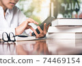Close up of women's hand using cellphone or mobile for search website,data,social network with comunication.Business and finance concept. 74469154