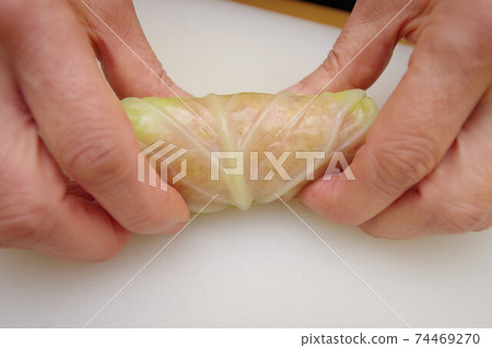 Making cabbage rolls 74469270