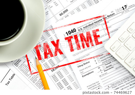 tax time stamp over 1040 form background 74469627