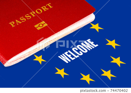 welcome, white text over eu flag and passport 74470402