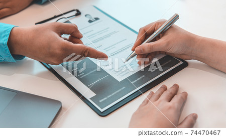 Job seeker has signed an employment contract with the employer or company HR, Signing a contract for applying for a job, Agreeing to the terms and conditions of the law. 74470467