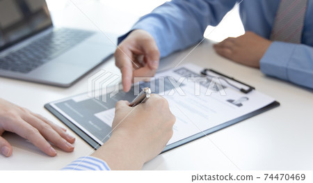 Job seeker has signed an employment contract with the employer or company HR, Signing a contract for applying for a job, Agreeing to the terms and conditions of the law. 74470469