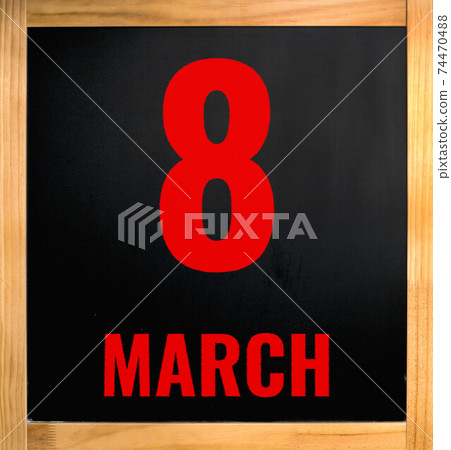 8 march, red chalk text over black board 8 march, red chalk text over black board 74470488