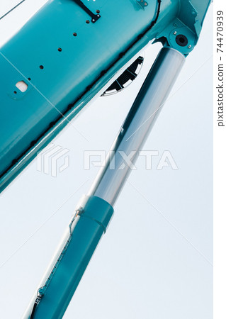 Hydraulic cylinder of the lifting system on a car crane.The control system of the crane engine.Lifting the hydraulic compartment on a truck crane. 74470939
