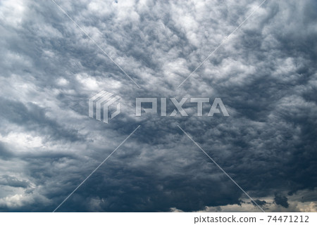 Dark storm clouds before rain. Dark storm clouds before rain. 74471212