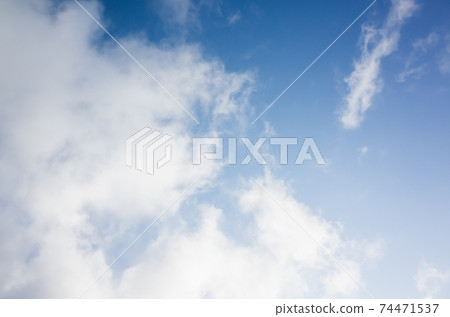 Blue sky with white cumulus clouds at daytime 74471537