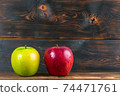 ripe juicy red and green apples on rustic wooden table 74471761