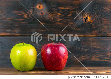 ripe juicy red and green apples on rustic wooden table 74471761