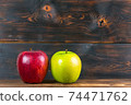 ripe juicy red and green apples on rustic wooden table 74471762