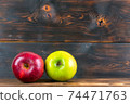 ripe juicy red and green apples on rustic wooden table 74471763