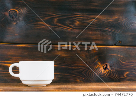 tea cup on rustic wooden table 74471770