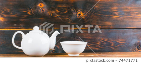 tea bowl and pot on rustic wooden table, panoramic shot tea bowl and pot on rustic wooden table, panoramic shot 74471771