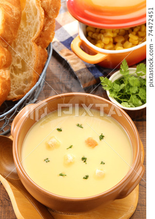 Corn potage and bread high angle vertical composition Corn potage and bread high angle vertical composition 74472451