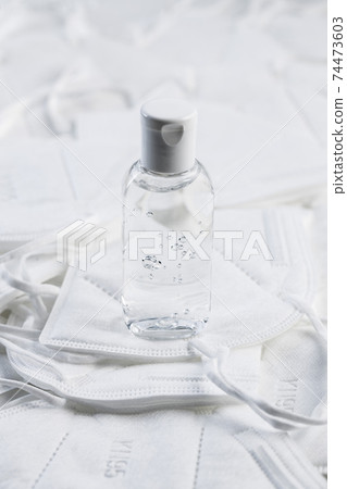 Hand sanitizer gel. KN95 face mask. FFP2 mask as covid-19 protection. 74473603
