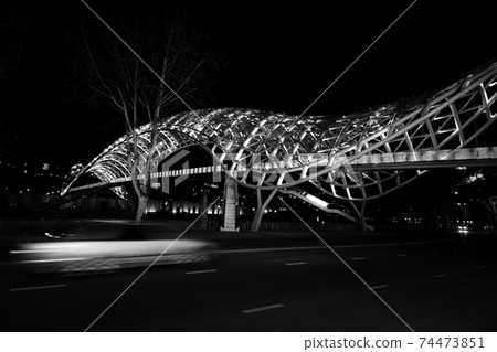 Bridge of Peace over Kura River illuminated at night. Tbilisi, Georgia. Bridge of Peace over Kura River illuminated at night. Tbilisi, Georgia. 74473851