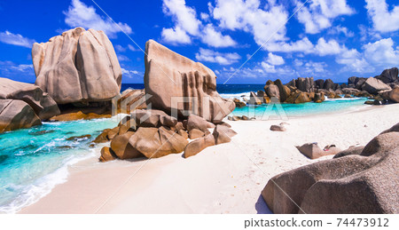 unique granite rocky beach Anse Marron in La Digue island, Seychelles. 74473912
