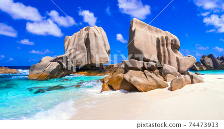unique granite rocky beach Anse Marron in La Digue island, Seychelles. 74473913