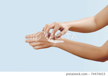 Beautiful Woman Hands. Female Hands Applying Cream, Lotion. Spa and Manicure concept. Soft skin, skincare concept. Hand Skin Care. Beautiful Woman Hands. Female Hands Applying Cream, Lotion. Spa and Manicure concept. Soft skin, skincare concept. Hand Skin Care. 74474015