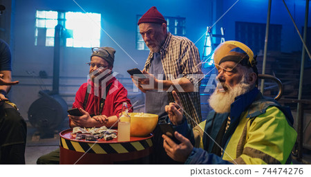 Men making online bets and discussing match 74474276